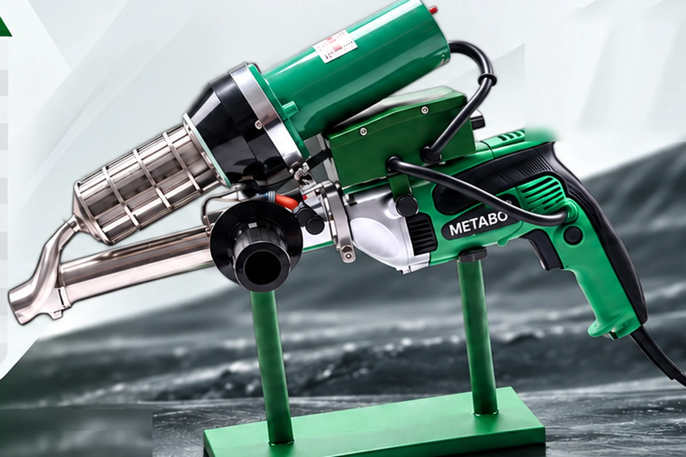 IZ-620 hand extrusion welding machine on a stand, showing the stainless preheat nozzle, extrusion barrel, rod feed inlet and pistol grip drive motor